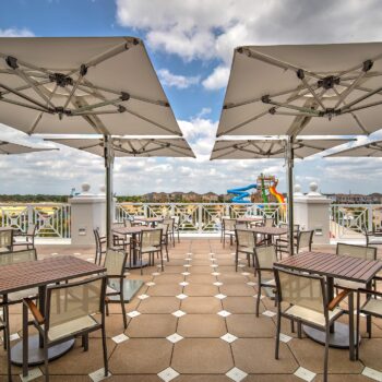 Shaded tables on the Encore Clubhouse deck.