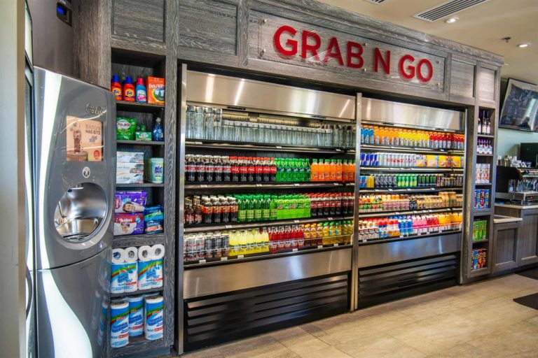 The Encore Resort Clubhouse Grab ’N Go store’s refrigerator filled with soft drinks and other beverages.