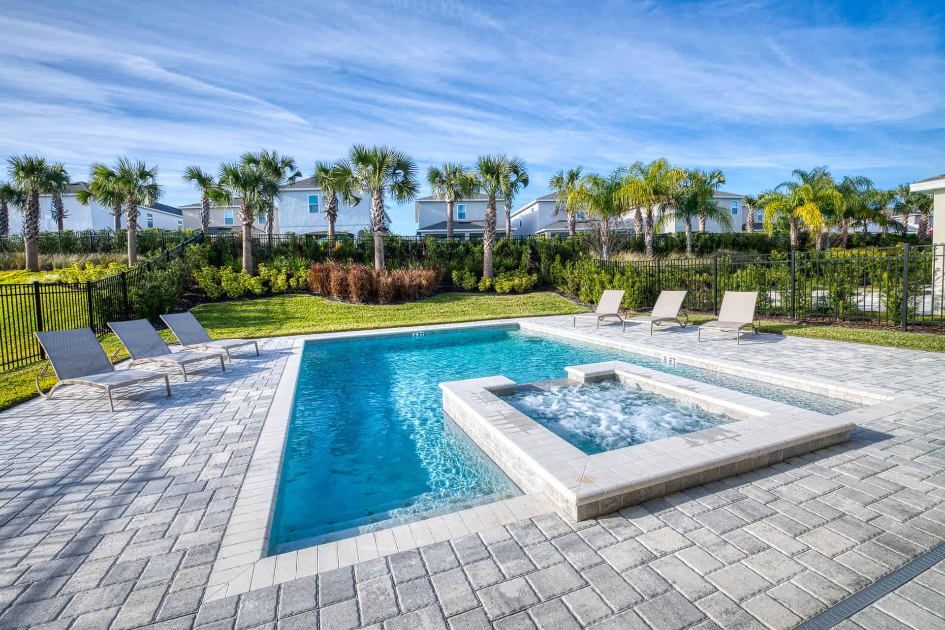 The hot tub of an Encore Resort vacation home rental’s private pool bubbles.