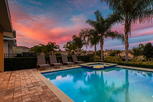 Private backyard pool at sunset.