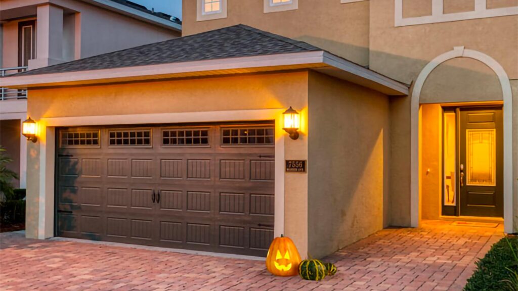 Pumpkin carved into a jack-o’-lantern on display outside an Encore Resort at Reunion curated resort residence.