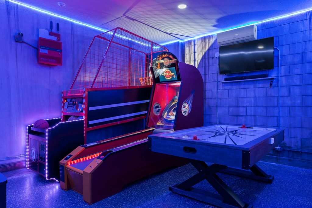 Arcade basketball, skee ball, and air hockey in Weathers’ Orlando vacation home.