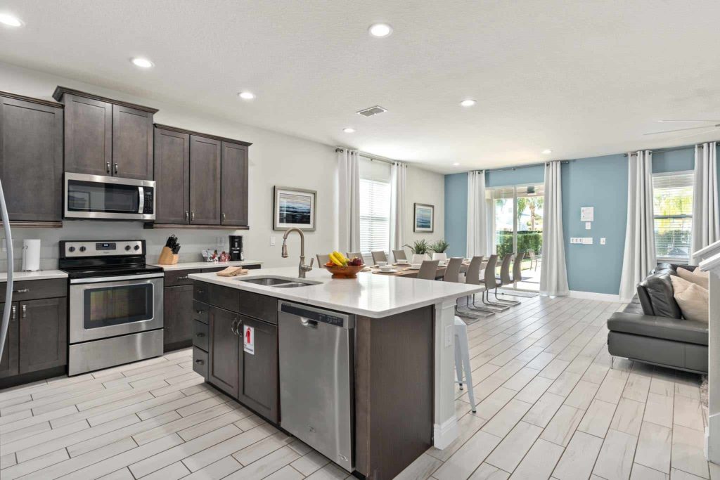Spacious kitchen with large island sink in Weathers’ Orlando vacation home.
