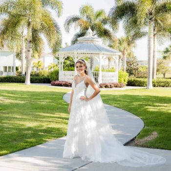 Bride in wedding dress in front of an outdoor gazebo at Encore Resort at Reunion