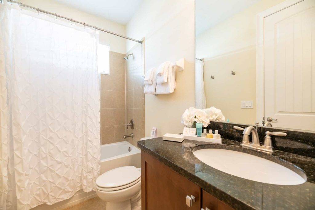 Bathroom with combination bathtub and shower.