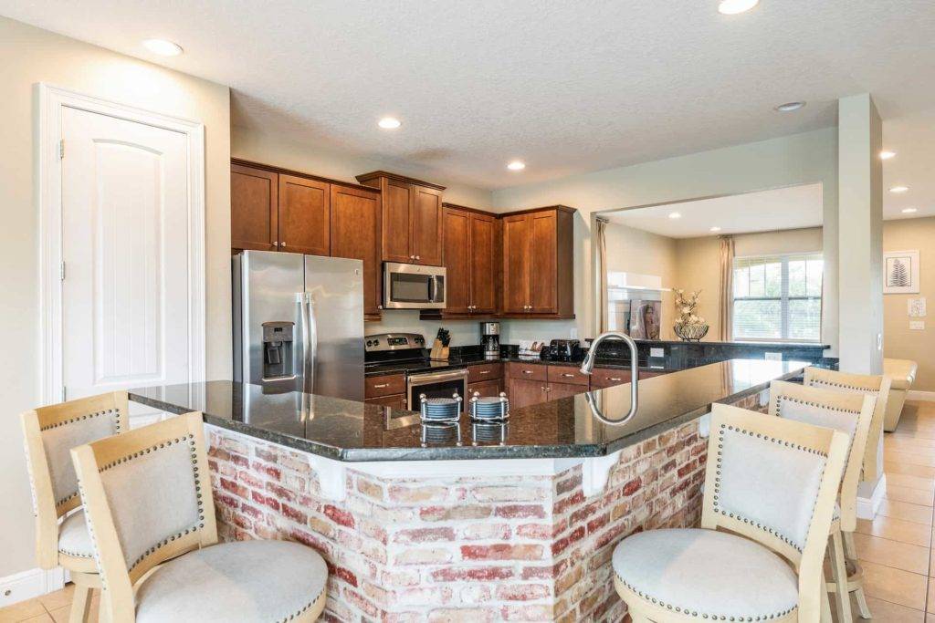 Full kitchen with large brick island counter