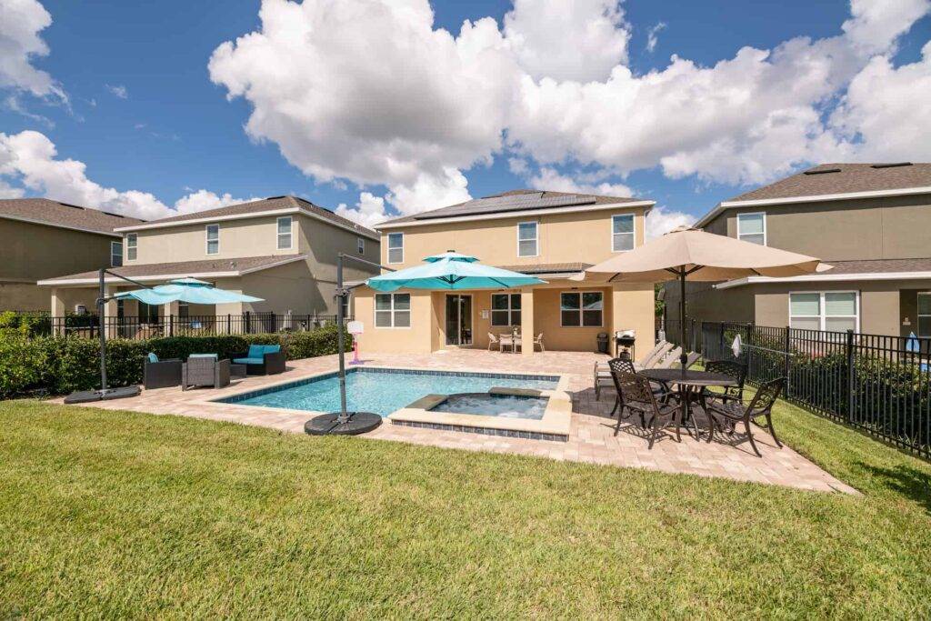 Backyard private pool with hot tub