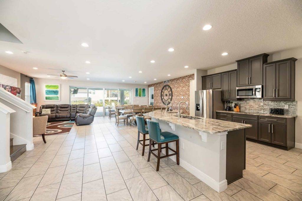 Fully equipped kitchen with barstool island seating