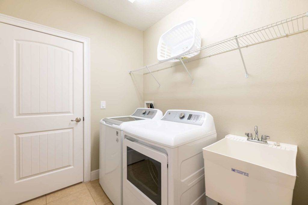 Vacation home laundry room with washer and dryer units
