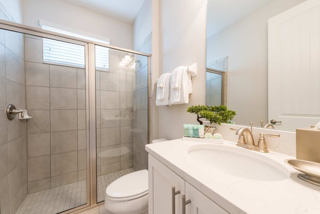Bathroom with sink, walk-in shower, and bathroom amenities: 5 Bedroom Vacation Home