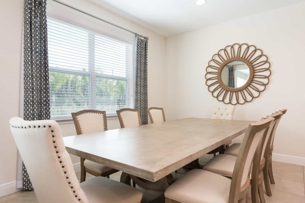 Dining room table with cushioned seats: 5 Bedroom Vacation Home