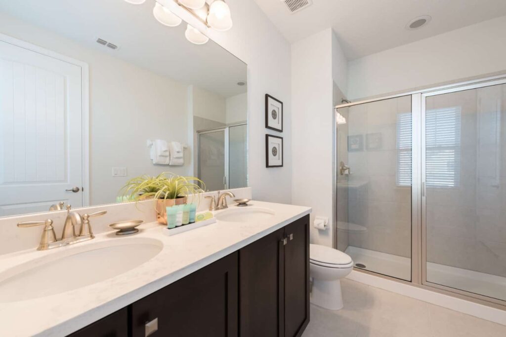 Bathroom with double sinks and walk-in shower: 8 Bedroom Vacation Home