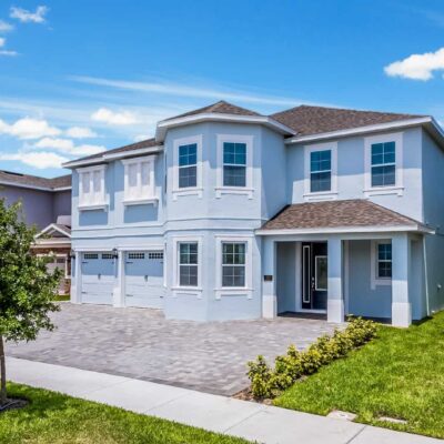 11 Bedroom Vacation Home external front with garden and brick driveway