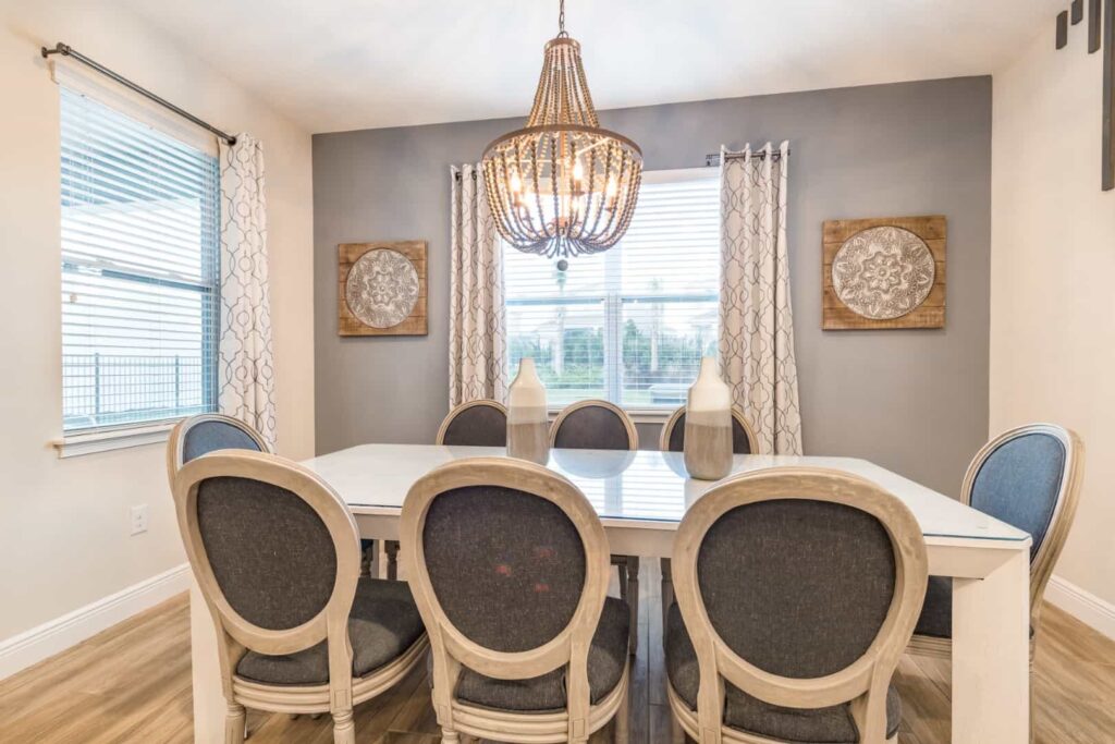 Dining room with cushioned seating at a 4 Bedroom Elite Home