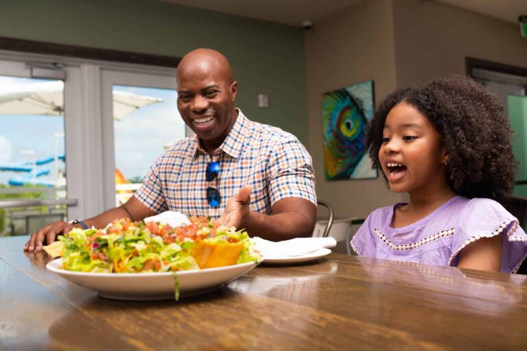 Happy father and daughter dining together at Finns Restaurant