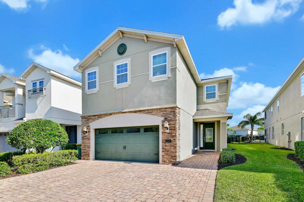 6-bedroom home external front with garden and private driveway parking