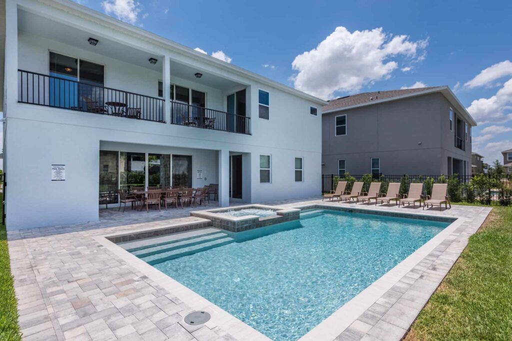 Private backyard with pool, covered lanai and balconies