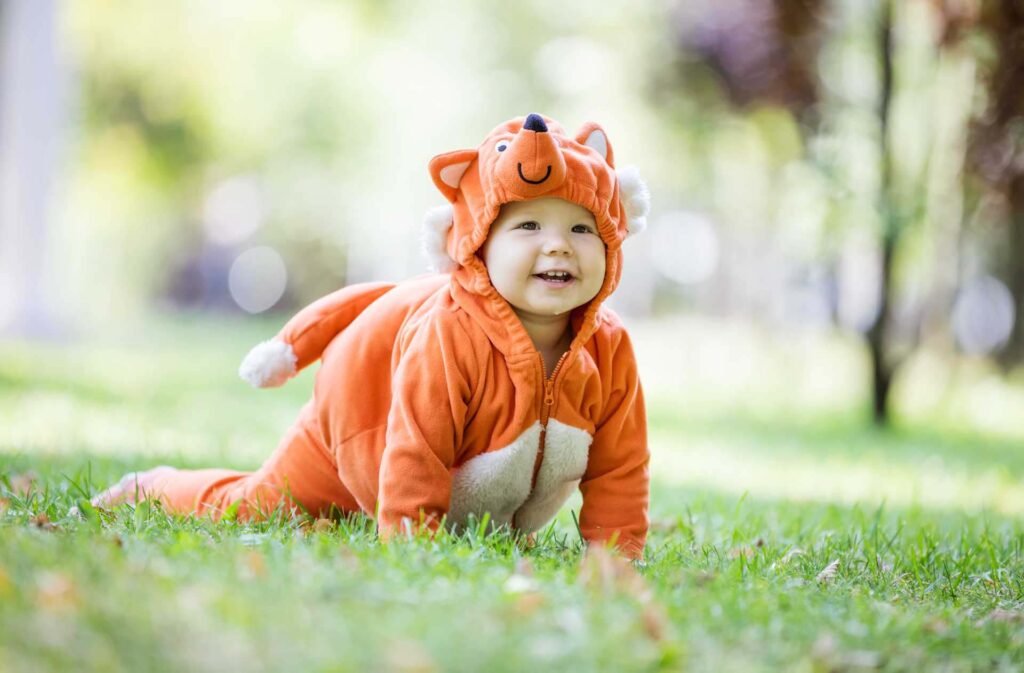 Baby girl dressed in a fox costume