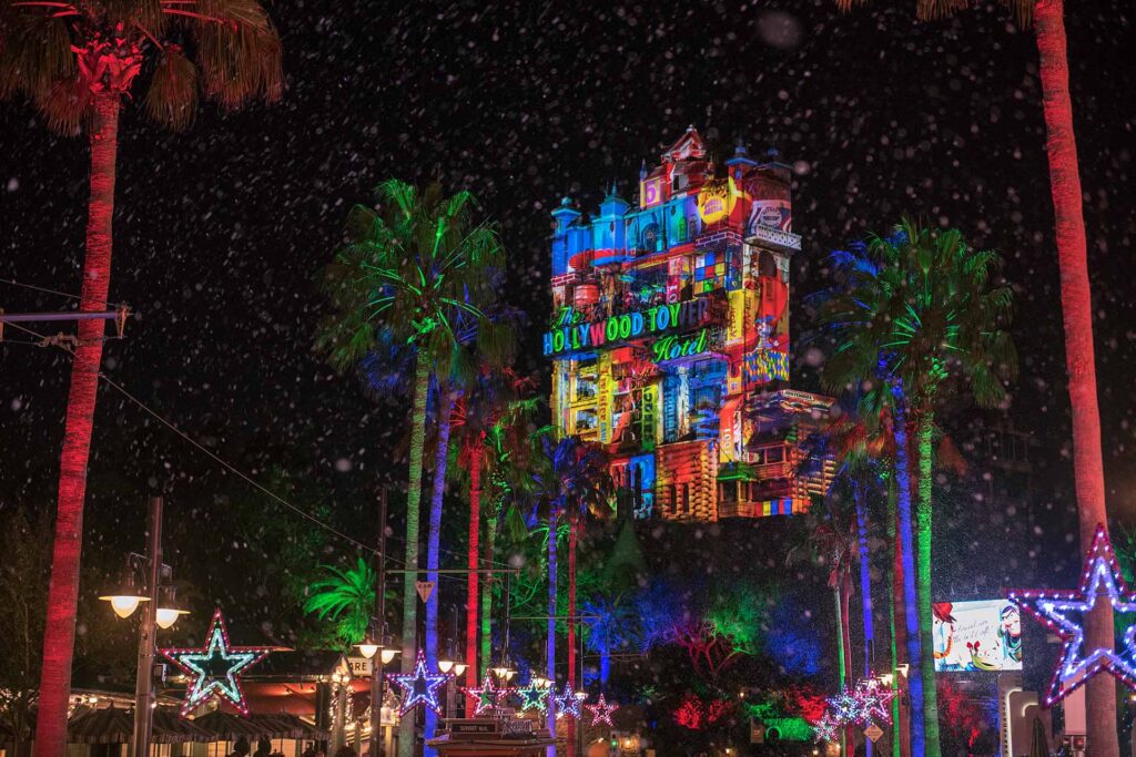 The Tower of Terror lit up with Christmas themed lights at Disney's Hollywood Studios