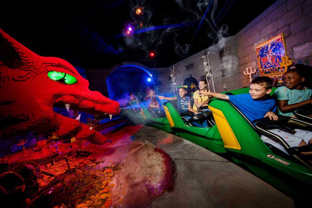 Group of kids riding on the LEGOLAND Dragon Coaster