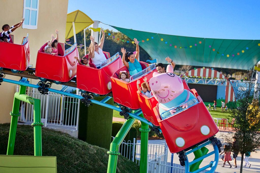 Families riding the Daddy Pig roller coaster at LEGOLAND Florida