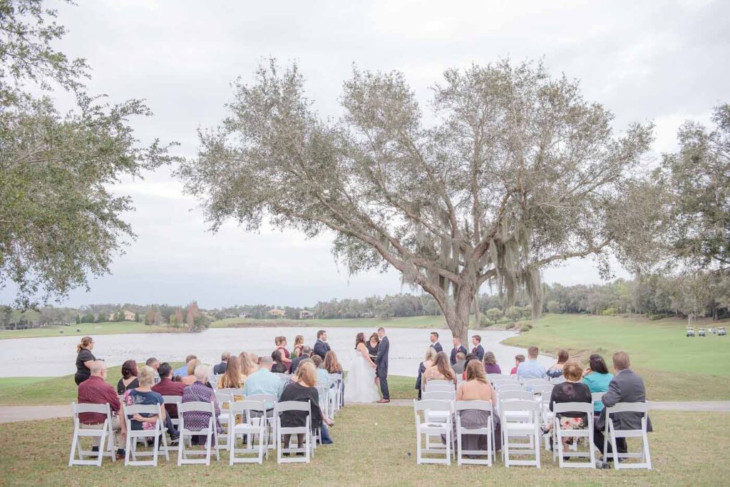 Wedding ceremony on a golf course next to a lake