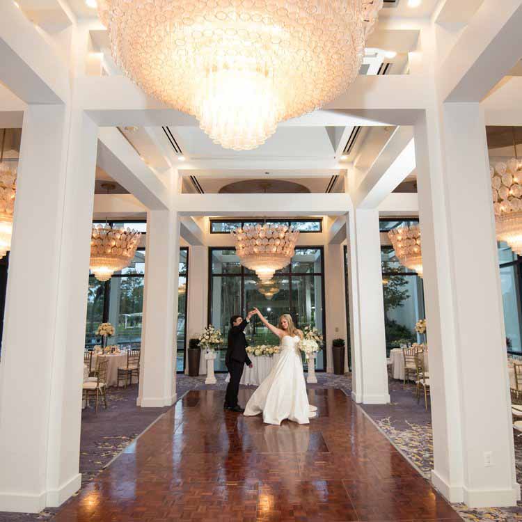 Bride and groom dancing in a ballroom at the Hyatt Regency Grand Cypress