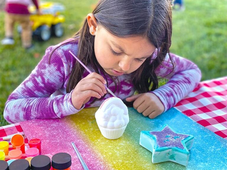 Activities Calendar 6 Young girl painting a ceramic figure