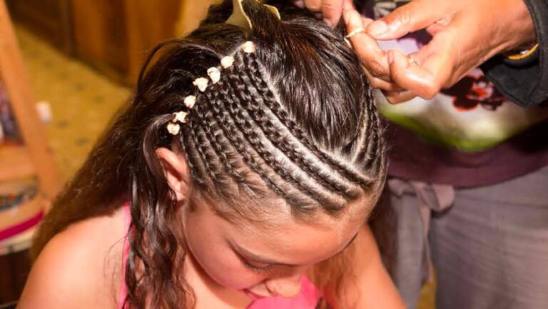Activities Calendar 8 Young girl getting her hair braided