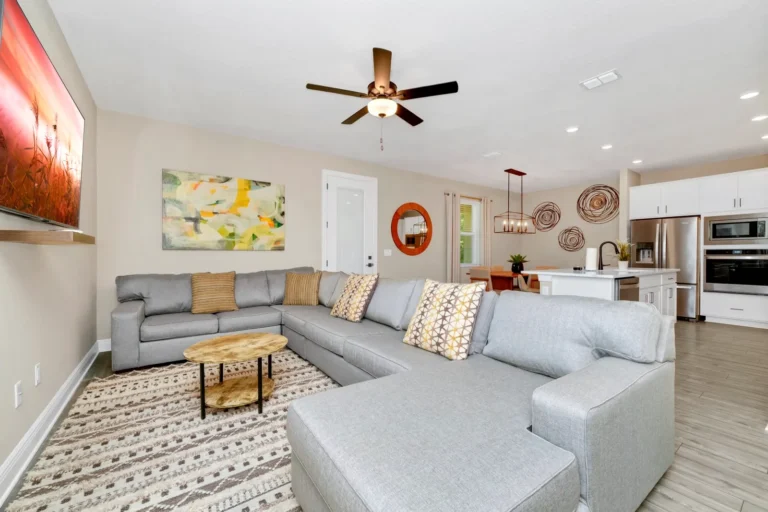 Living room with spacious sectional sofa in a Reunion Village home